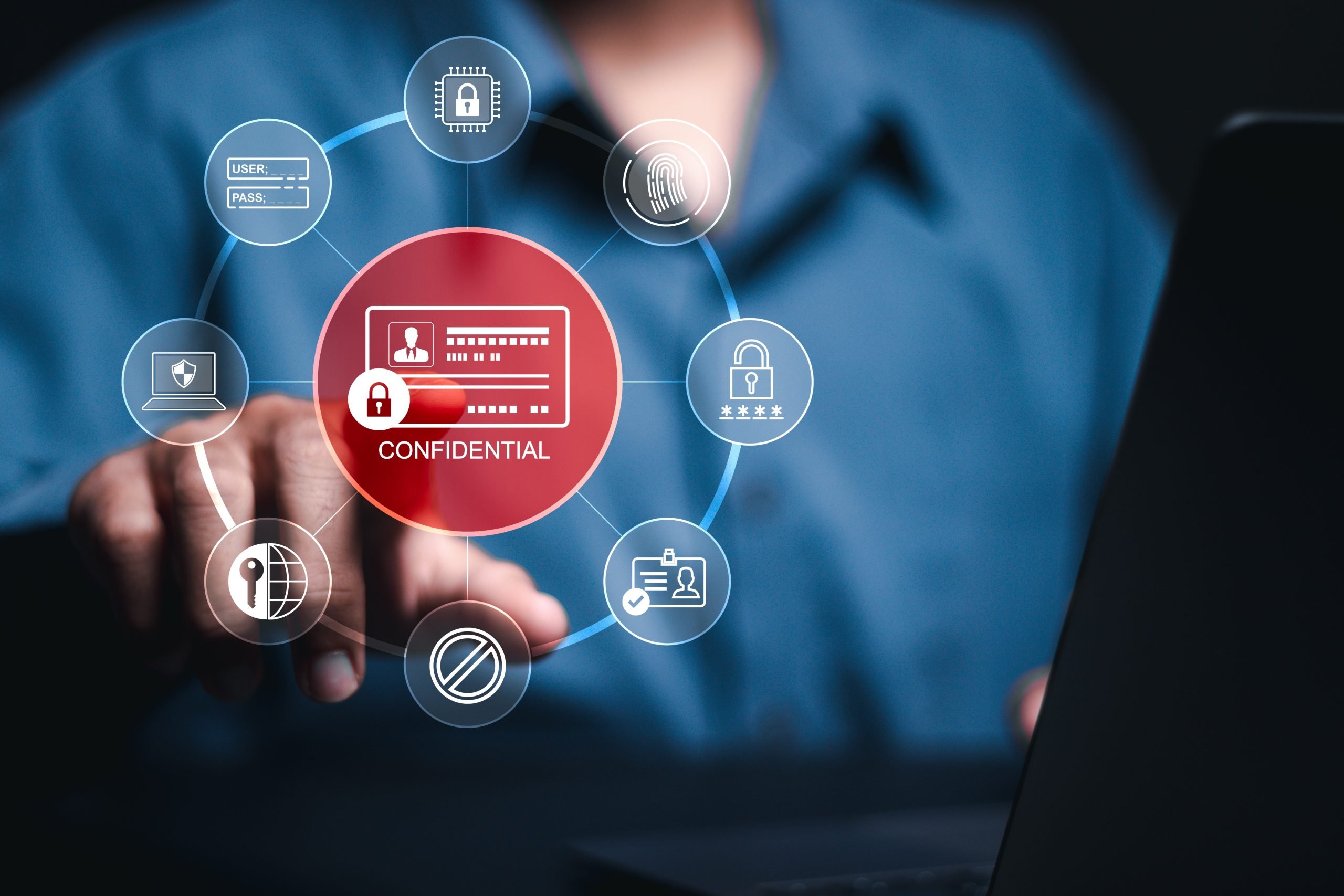 Person pointing at the word confidential and icon on virtual screen