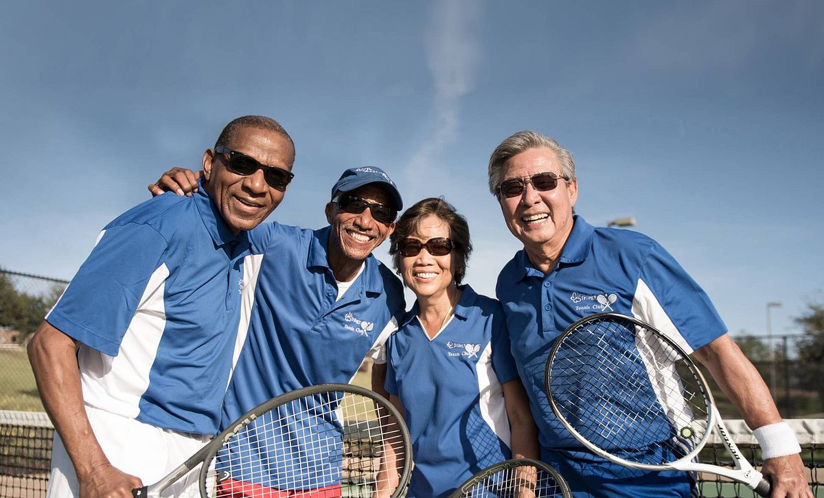 Members playing tennis at Trilogy Orlando
