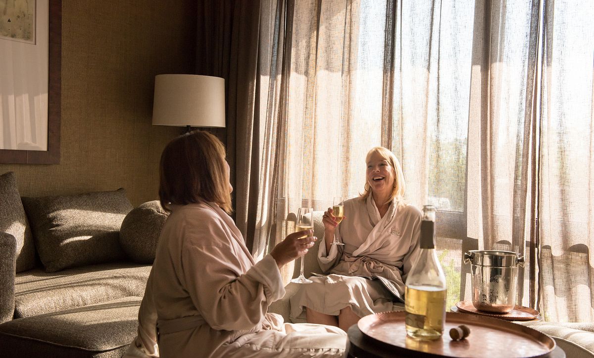 Woman drinking wine during a spa day